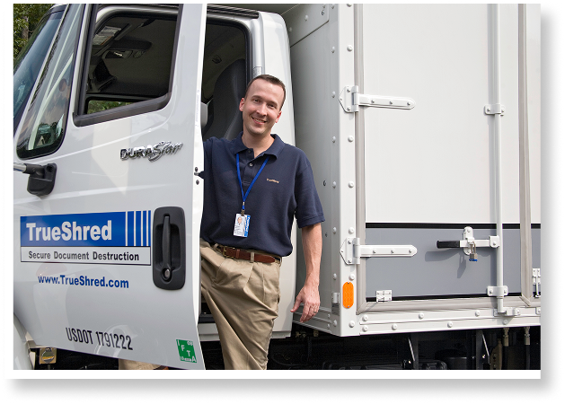 trueshred secure document shredding and destruction employee standing in open door of mobile truck